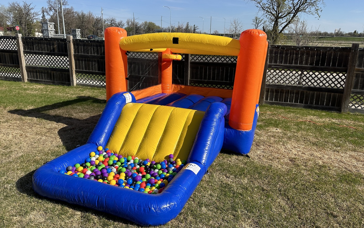 Orange Splash Bouncer with Slide party rentals Winnipeg Manitoba