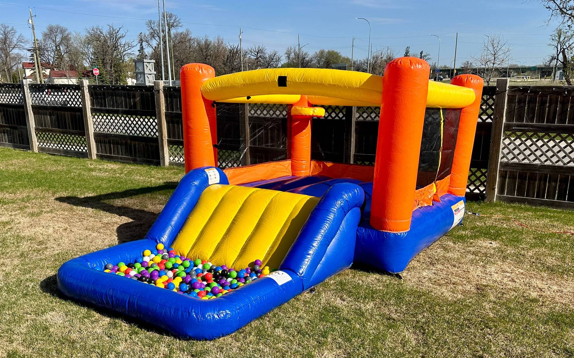 Orange Splash Bouncer with Slide party rentals Winnipeg Manitoba