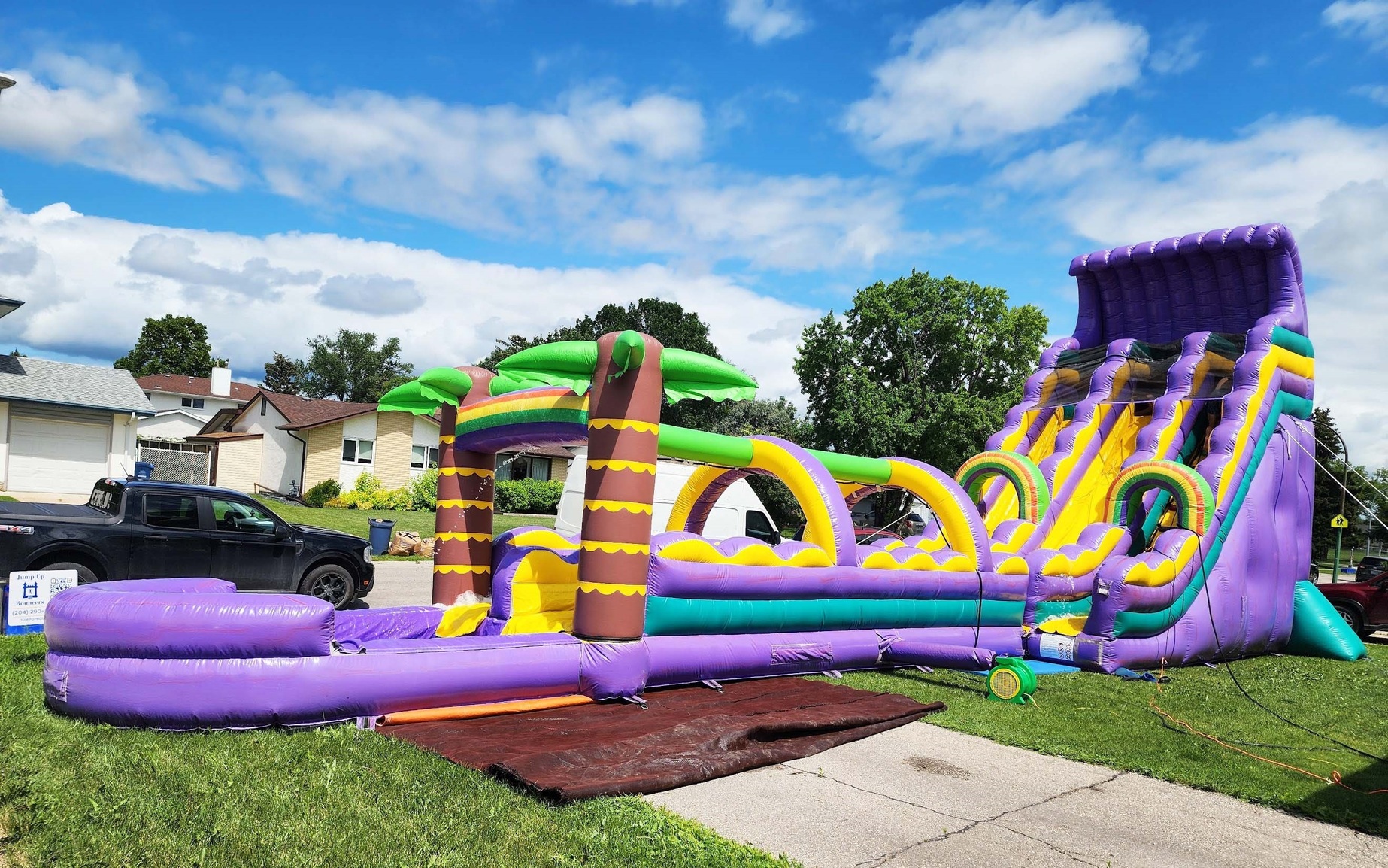 Tropical Dual Lane Waterslide with Slip and Slide inflatable bouncer party rentals Winnipeg Manitoba