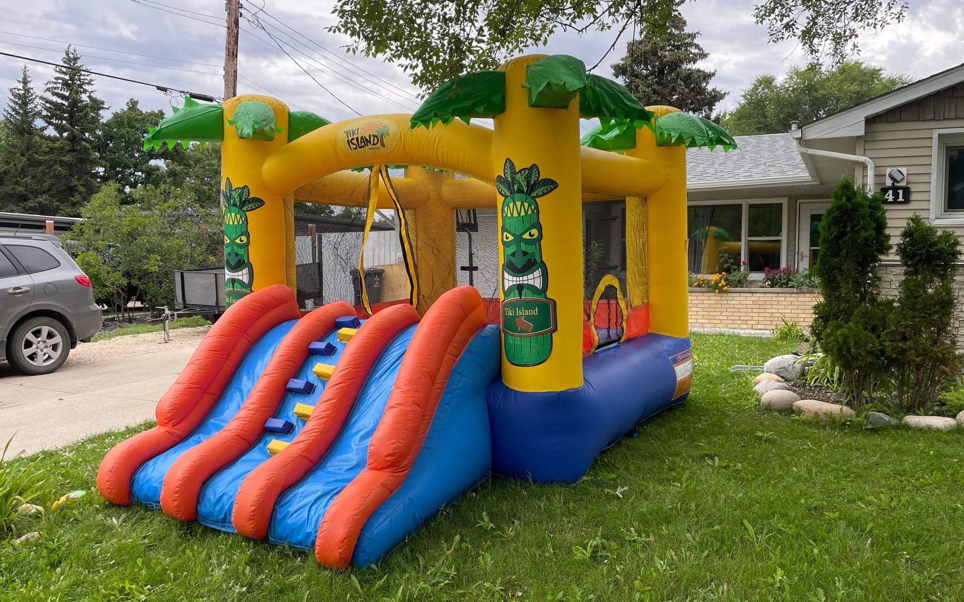 Tiki Island Inflatable Bouncy Castle With Slide Rentals Winnipeg Manitoba